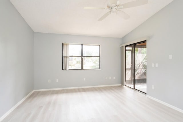 unfurnished room featuring lofted ceiling, ceiling fan, and light hardwood / wood-style flooring