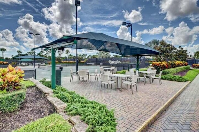 view of patio / terrace featuring tennis court