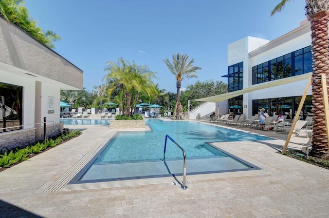 view of swimming pool featuring a patio area