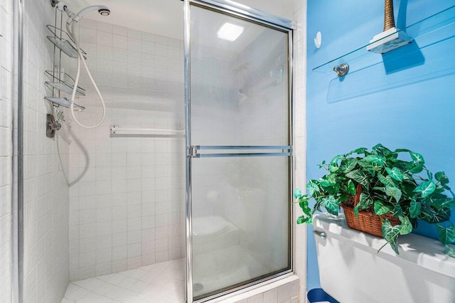 bathroom featuring a shower with door