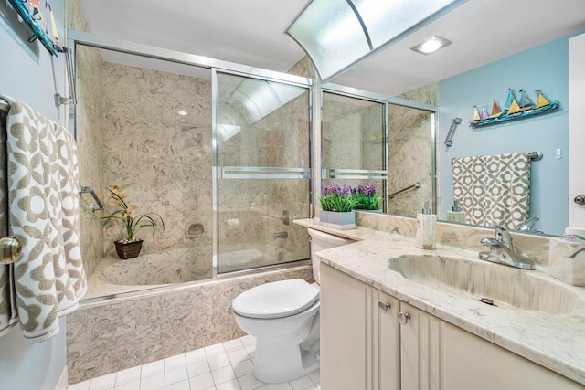 5087 Oak Hill Ln Unit 315, Delray Beach, FL 33484 - full bath with vanity, toilet, shower / bath combination with glass door, and tile patterned floors