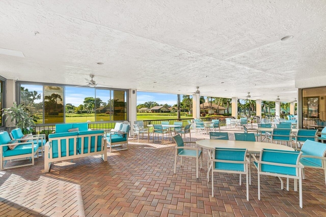 5087 Oak Hill Ln Unit 315, Delray Beach, FL 33484 - view of patio with an outdoor living space, outdoor dining space, and a ceiling fan