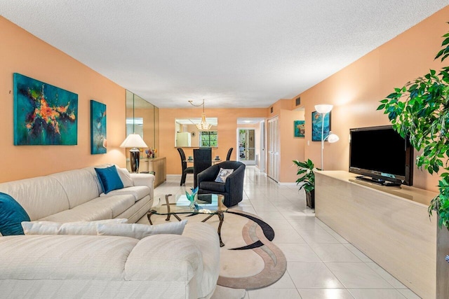 5087 Oak Hill Ln Unit 315, Delray Beach, FL 33484 - living room with a textured ceiling, visible vents, and light tile patterned flooring