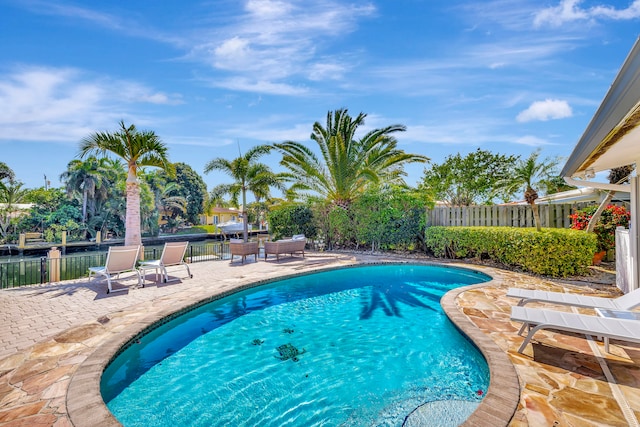 view of swimming pool with a patio