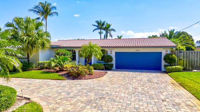 mediterranean / spanish-style home featuring a garage