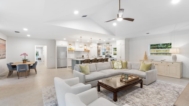 living room featuring high vaulted ceiling and ceiling fan