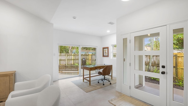 doorway to outside with light tile floors