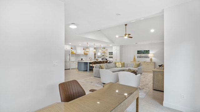 interior space featuring ceiling fan and lofted ceiling