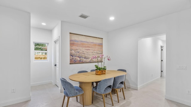 dining room with light tile floors