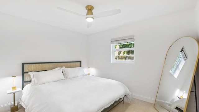 bedroom with light colored carpet and ceiling fan