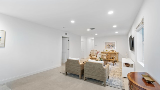 living room featuring light carpet