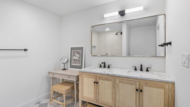 bathroom with oversized vanity and dual sinks