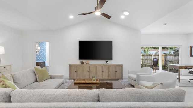 carpeted living room with high vaulted ceiling and ceiling fan