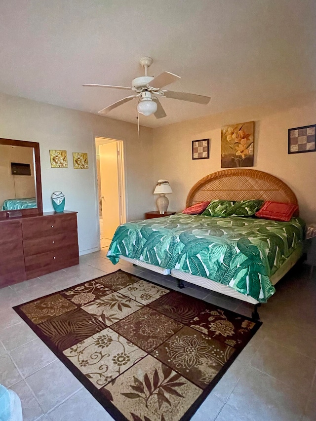 bedroom featuring connected bathroom, ceiling fan, and light tile floors