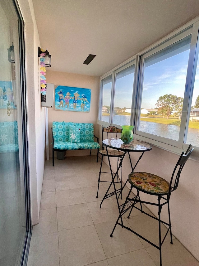 sunroom with a water view