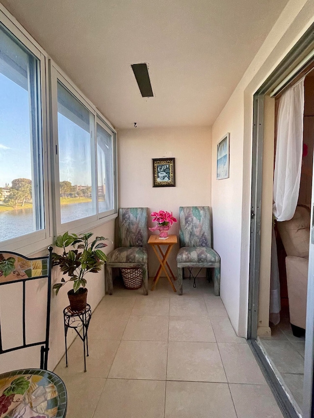 sunroom with a water view