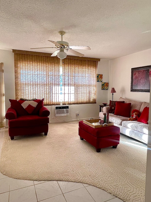 living room with a textured ceiling, ceiling fan, and a wall unit AC