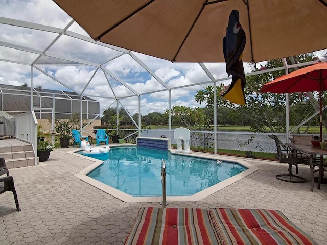 view of pool with a lanai and a patio