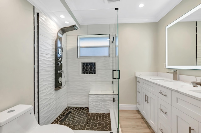 bathroom with a shower with door, ornamental molding, and toilet