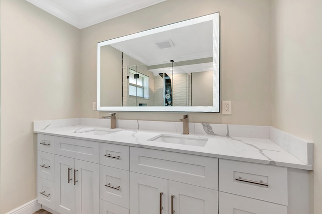 bathroom with double sink vanity and crown molding