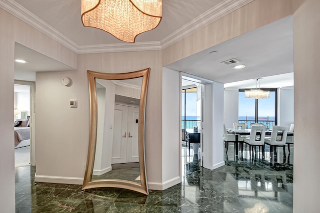 corridor featuring a water view, expansive windows, crown molding, and a notable chandelier