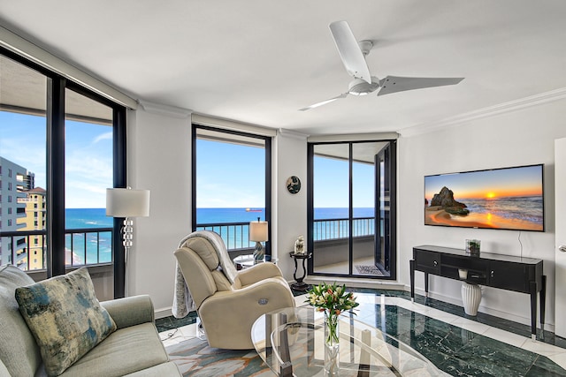 living room with a healthy amount of sunlight, expansive windows, ornamental molding, and ceiling fan