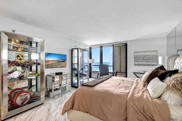 bedroom with floor to ceiling windows