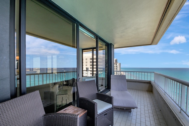 balcony featuring a water view