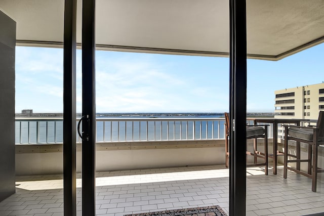 balcony featuring a water view