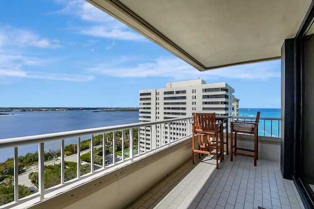 balcony featuring a water view