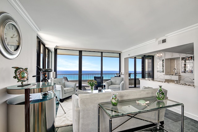 living room with sink, floor to ceiling windows, a water view, and crown molding