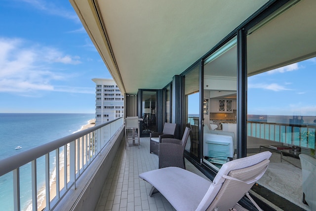 balcony featuring a water view