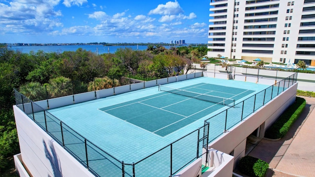 view of sport court featuring a water view