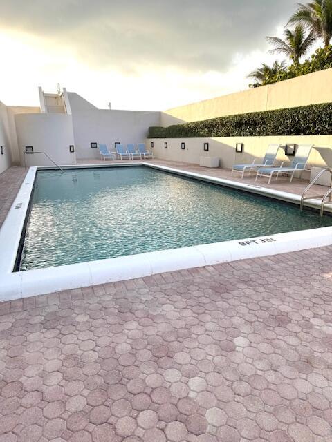 5250 N Ocean Dr Phn, Phn, Singer Island, FL 33404 - community pool featuring a patio area