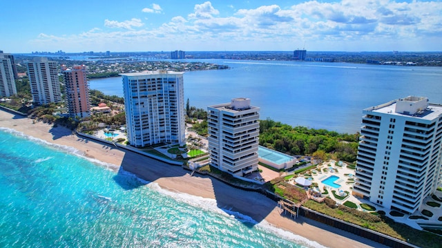 bird's eye view with a water view and a view of the beach