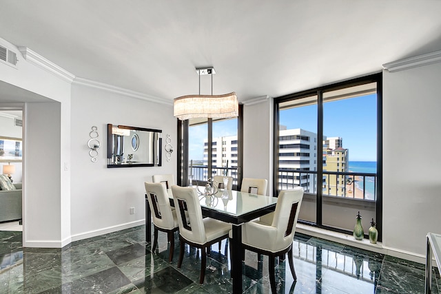 dining area with plenty of natural light, floor to ceiling windows, a water view, and crown molding