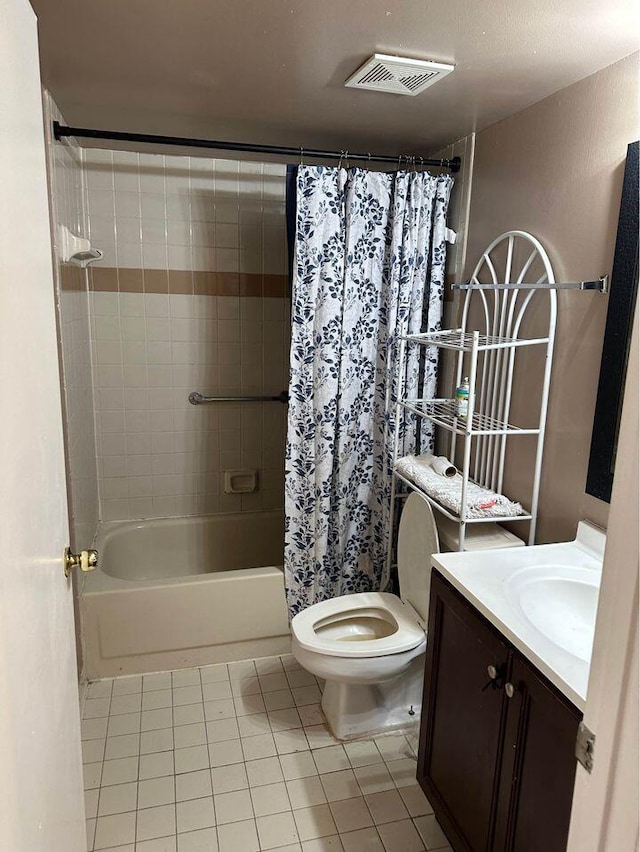 full bathroom with vanity, tile floors, shower / tub combo with curtain, and toilet