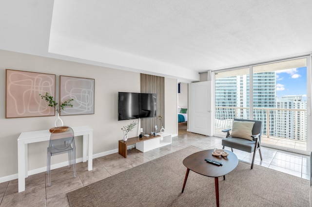 tiled living room with a wall of windows