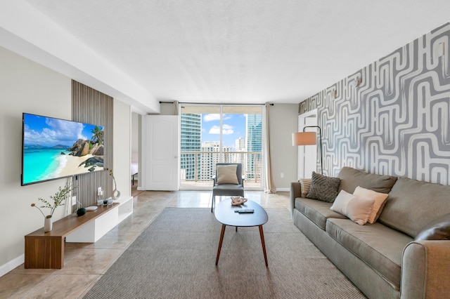 living room with expansive windows and light tile floors