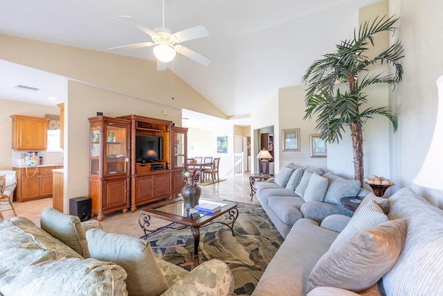 living room with light tile floors, high vaulted ceiling, and ceiling fan