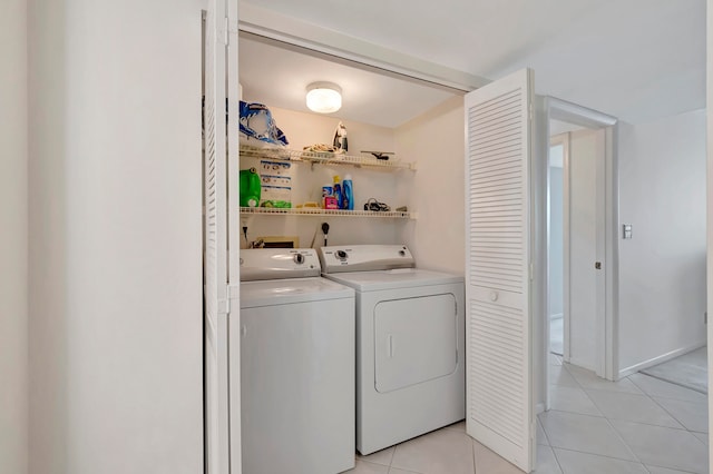 laundry area with washer hookup, light tile flooring, washing machine and dryer, and hookup for an electric dryer