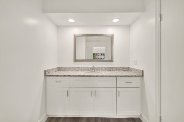 bathroom with wood-type flooring and vanity