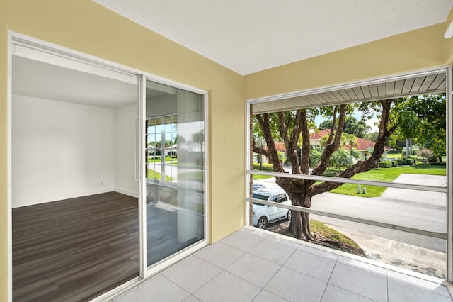 unfurnished sunroom featuring a wealth of natural light