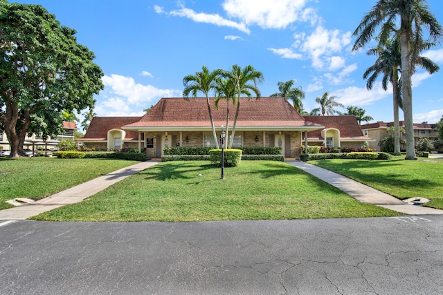 ranch-style home with a front yard