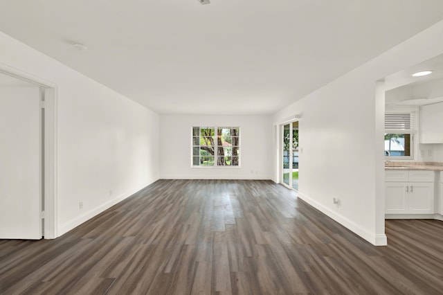 spare room featuring dark hardwood / wood-style flooring and sink