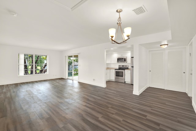 unfurnished living room featuring dark hardwood / wood-style floors and a chandelier