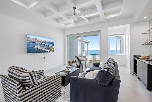 living room featuring a ceiling fan, baseboards, coffered ceiling, and beamed ceiling