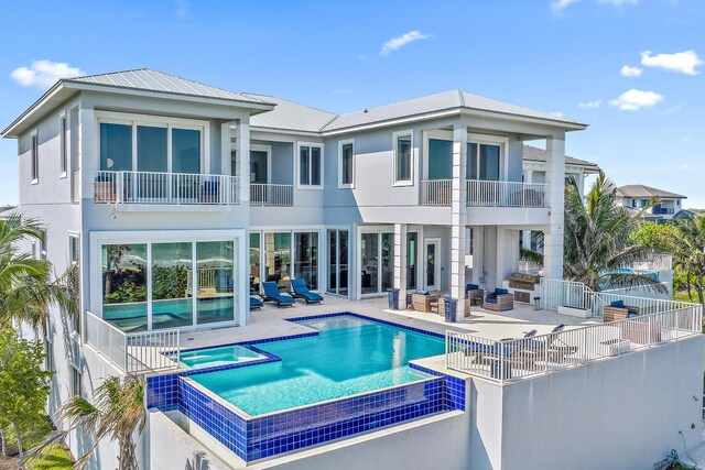 view of front of house with a balcony and a garage