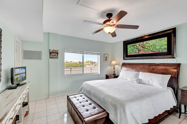 tiled bedroom with ceiling fan