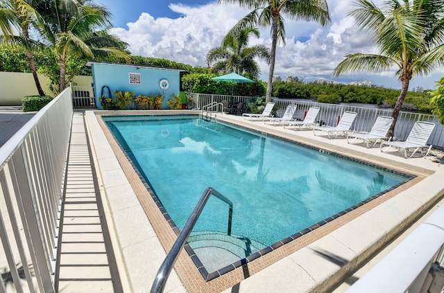 view of swimming pool featuring a patio area